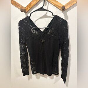 Free People black lace top features a criss-cross top